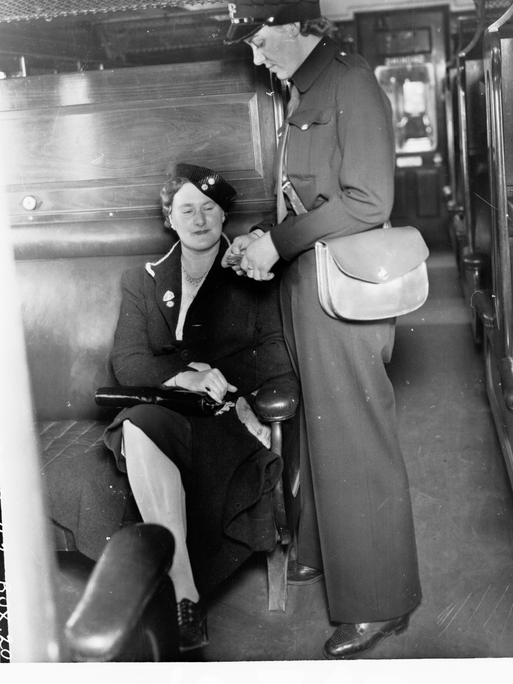 South Australian Railways female ticket collector showing female passenger