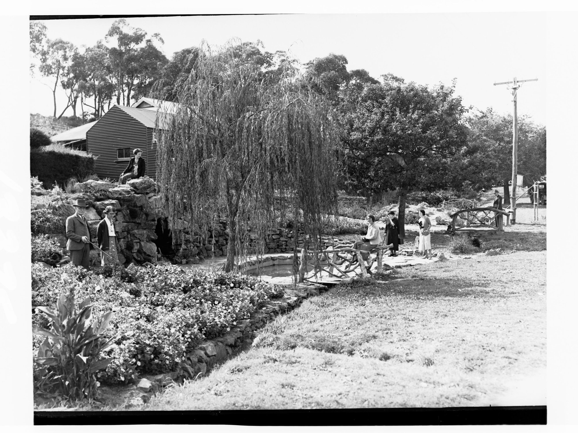 Men and women in a garden at Stirling