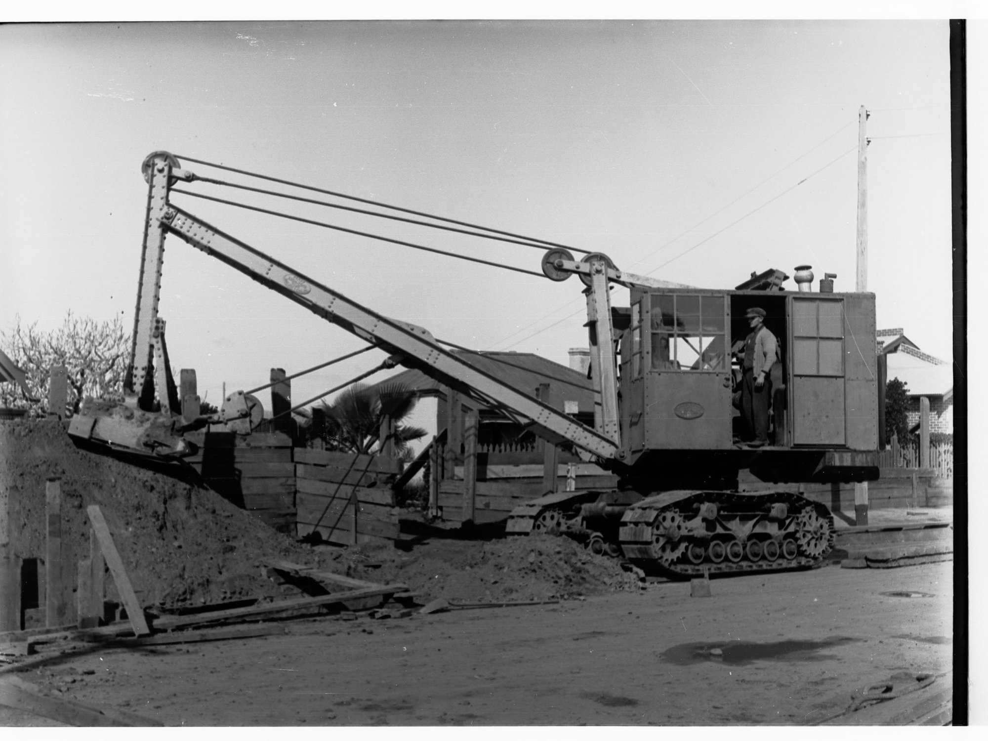 Sewers Department, Glenelg, showing backhoe excavation