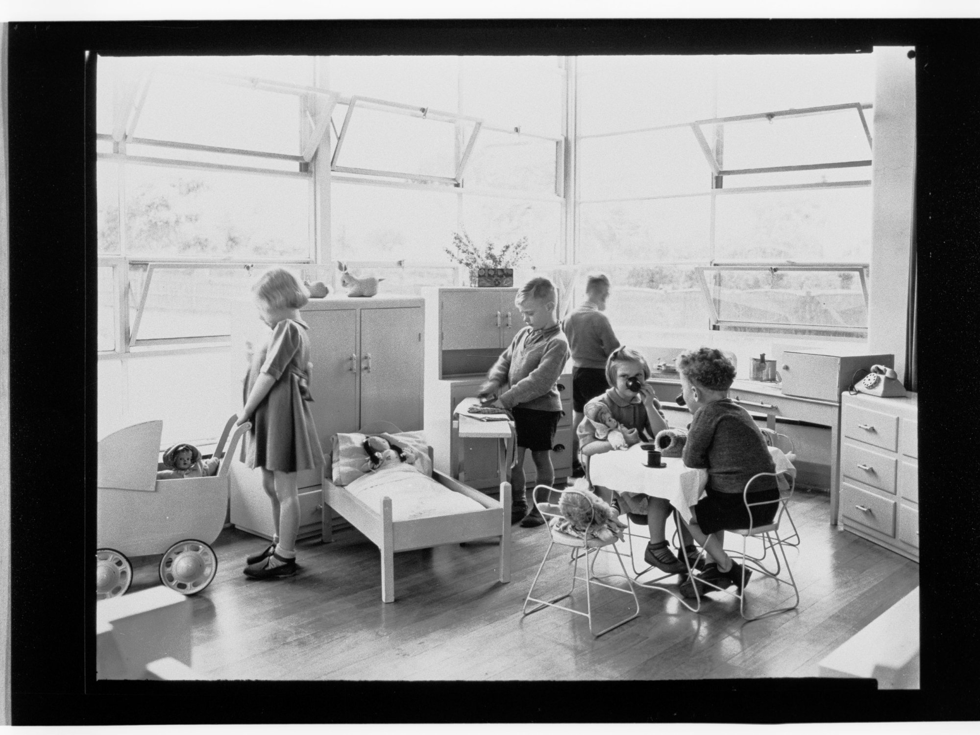 Children's Welfare Department - children in home corner of playroom