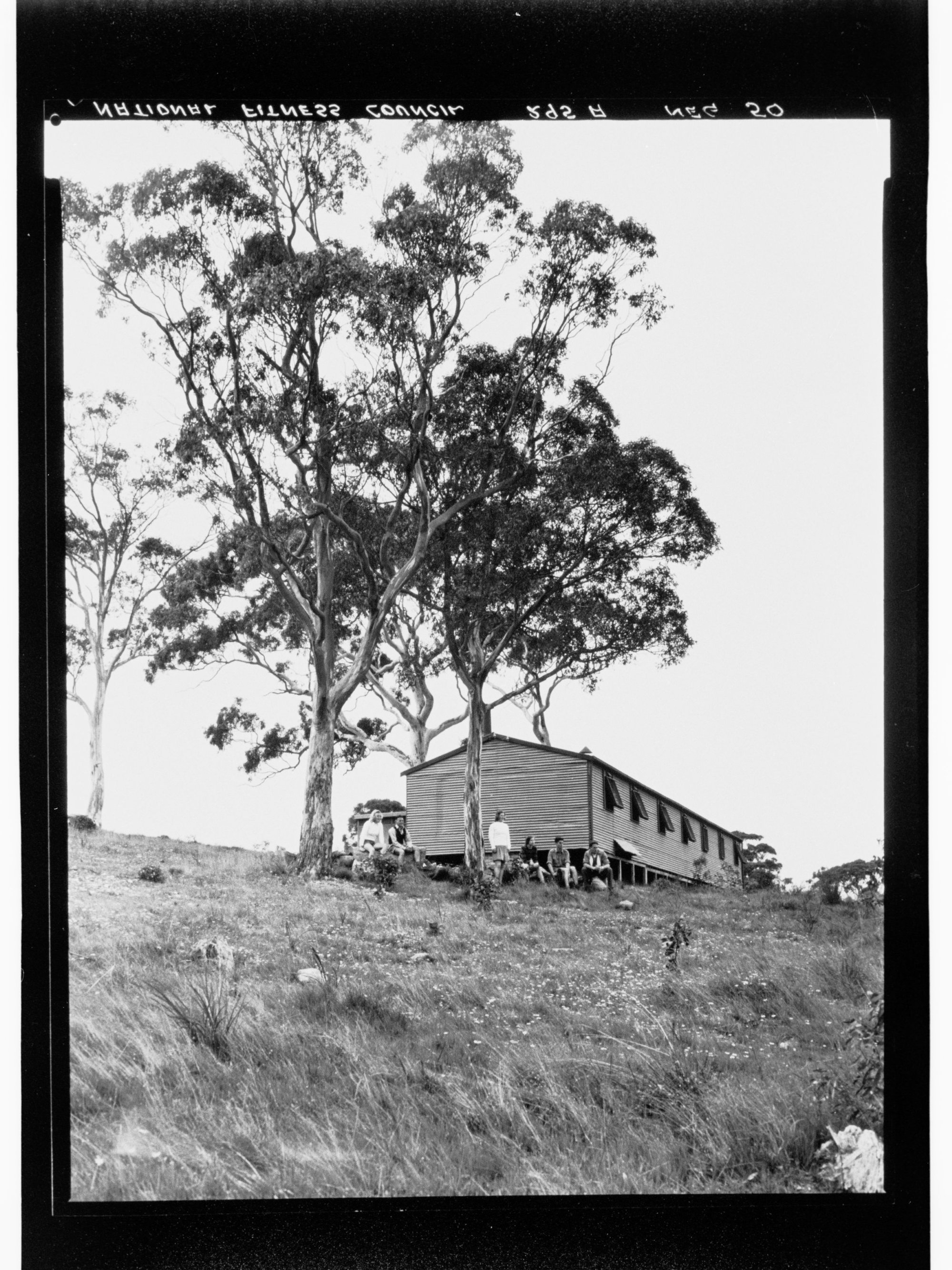 National Fitness Council - people outside a cabin
