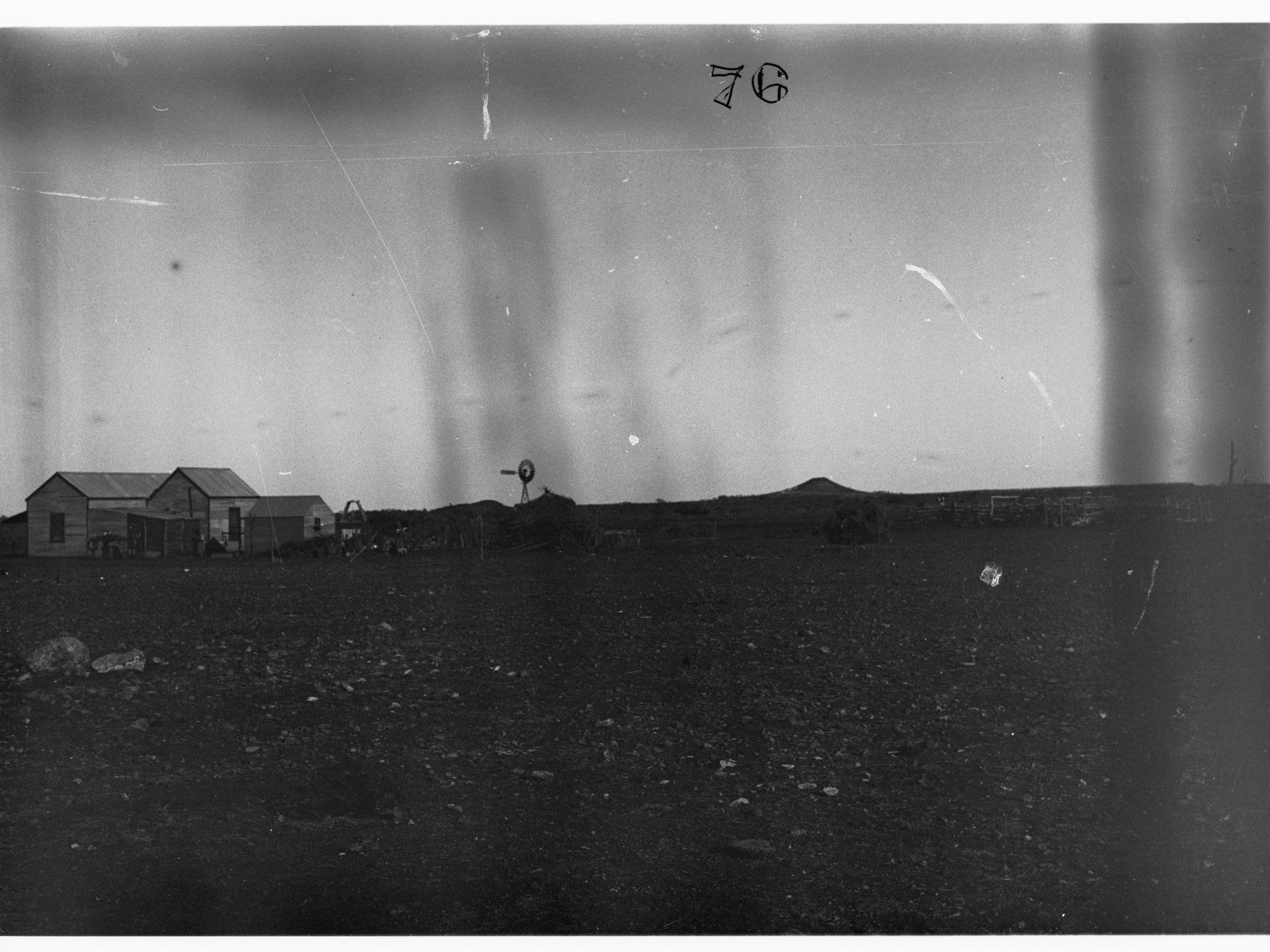 Parliamentary party on tour of Far North in Austin cars (government cars) - shows farmhouse and windmill in distance