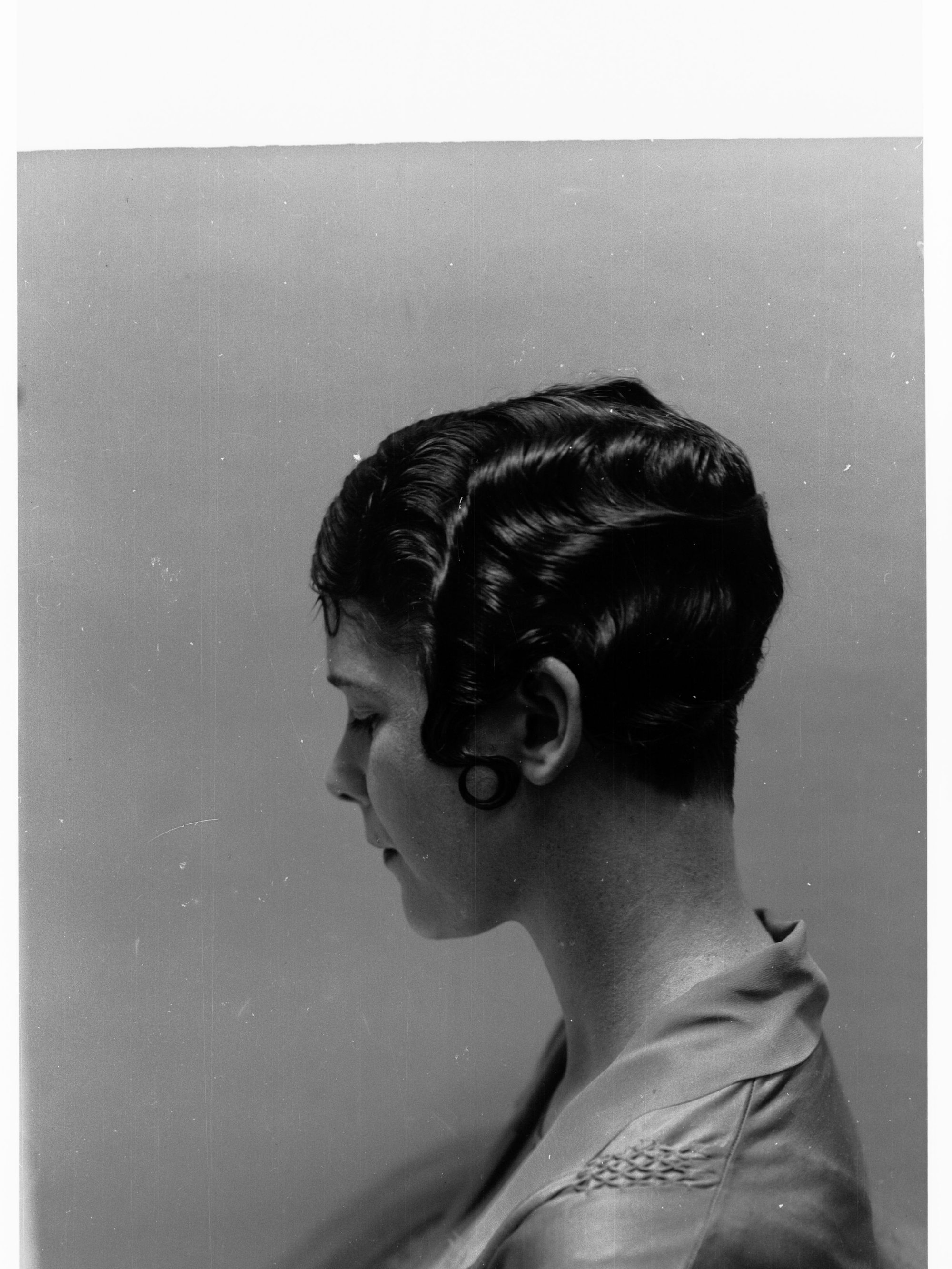 Portrait of a woman showing hairstyle done at Mitzi's Hairdressers, Adelaide Station