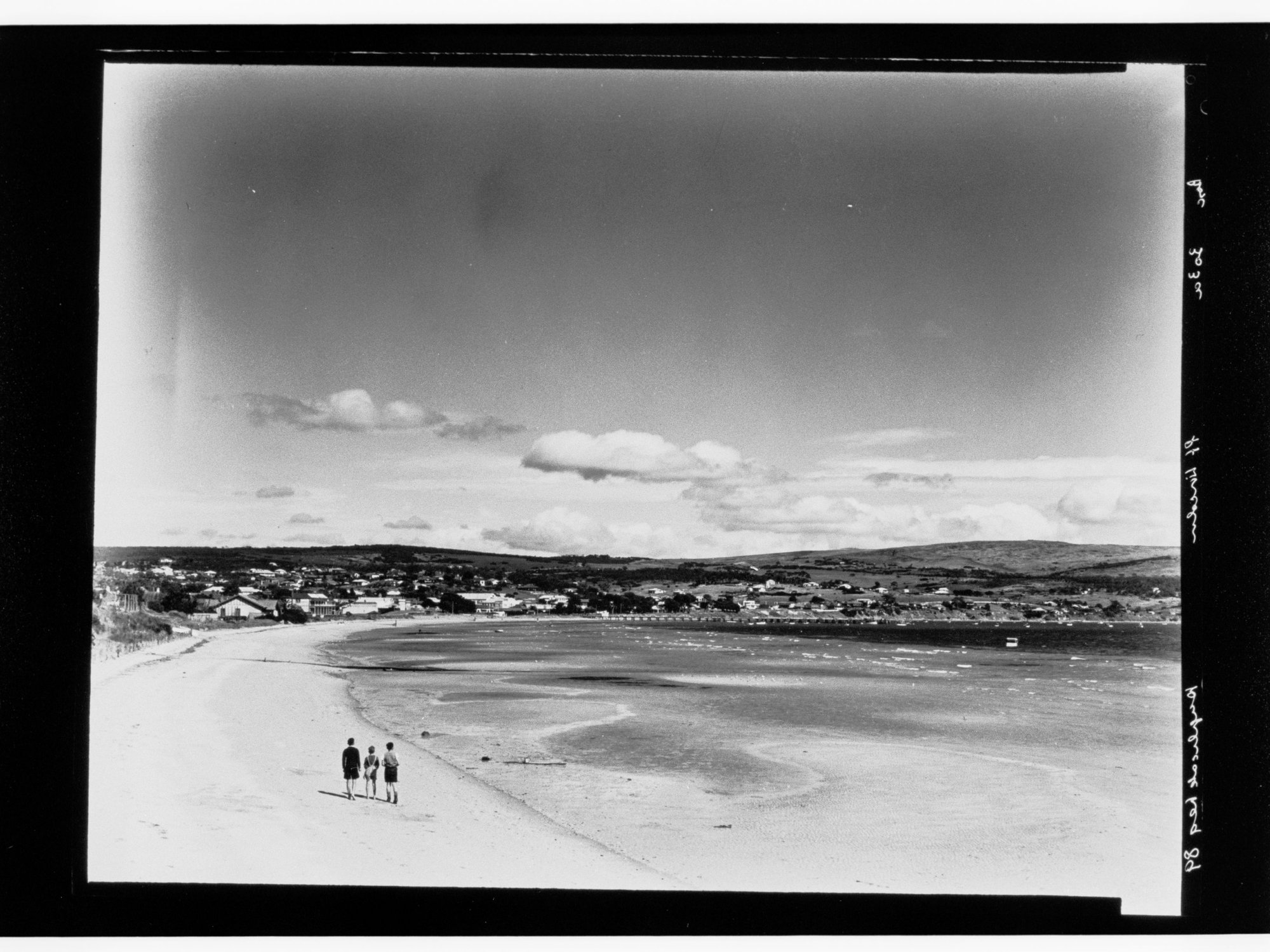Three people walking on beach at Port Lincoln