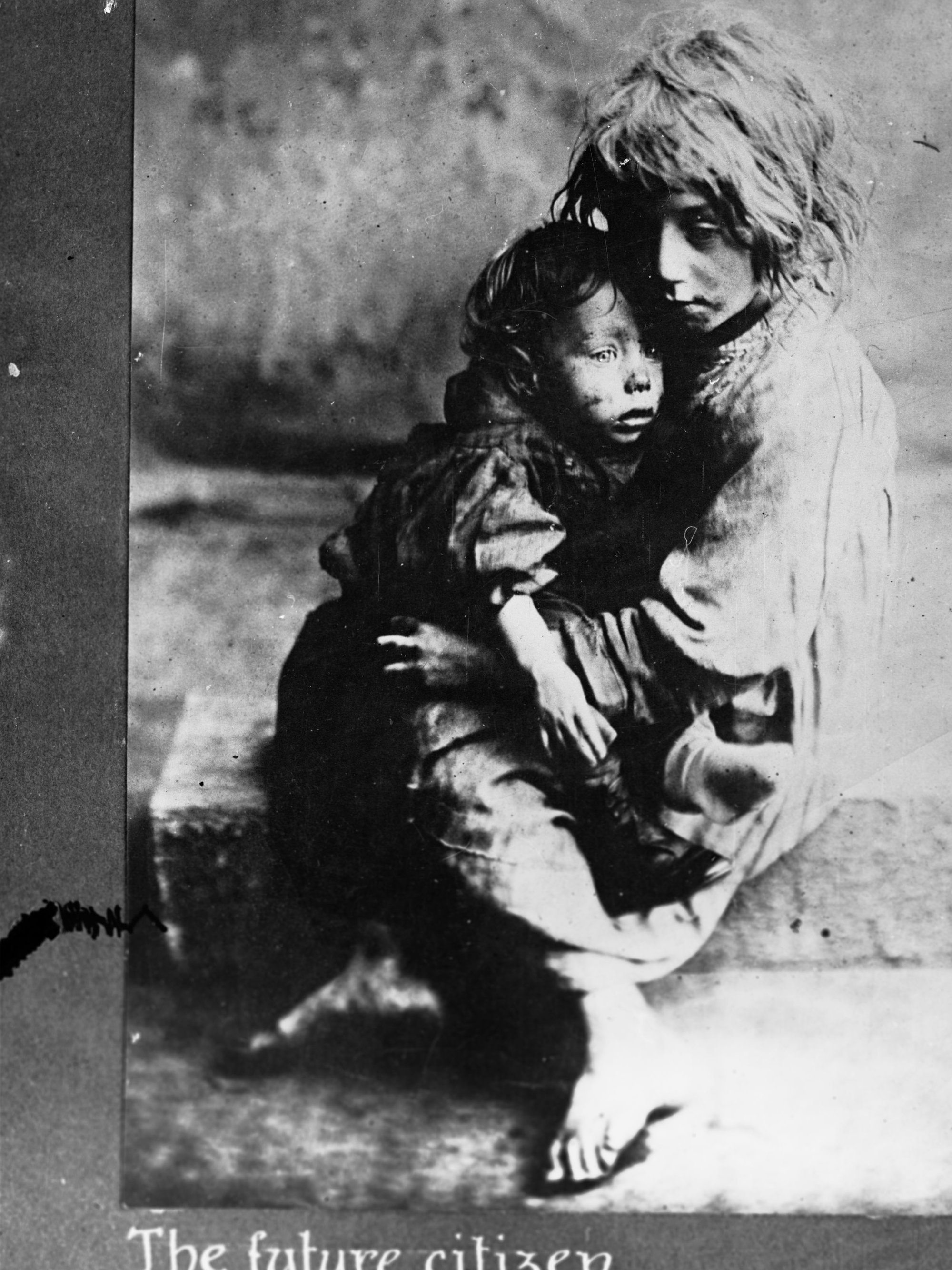 Portrait of two destitute children - titled "The Future Citizen".