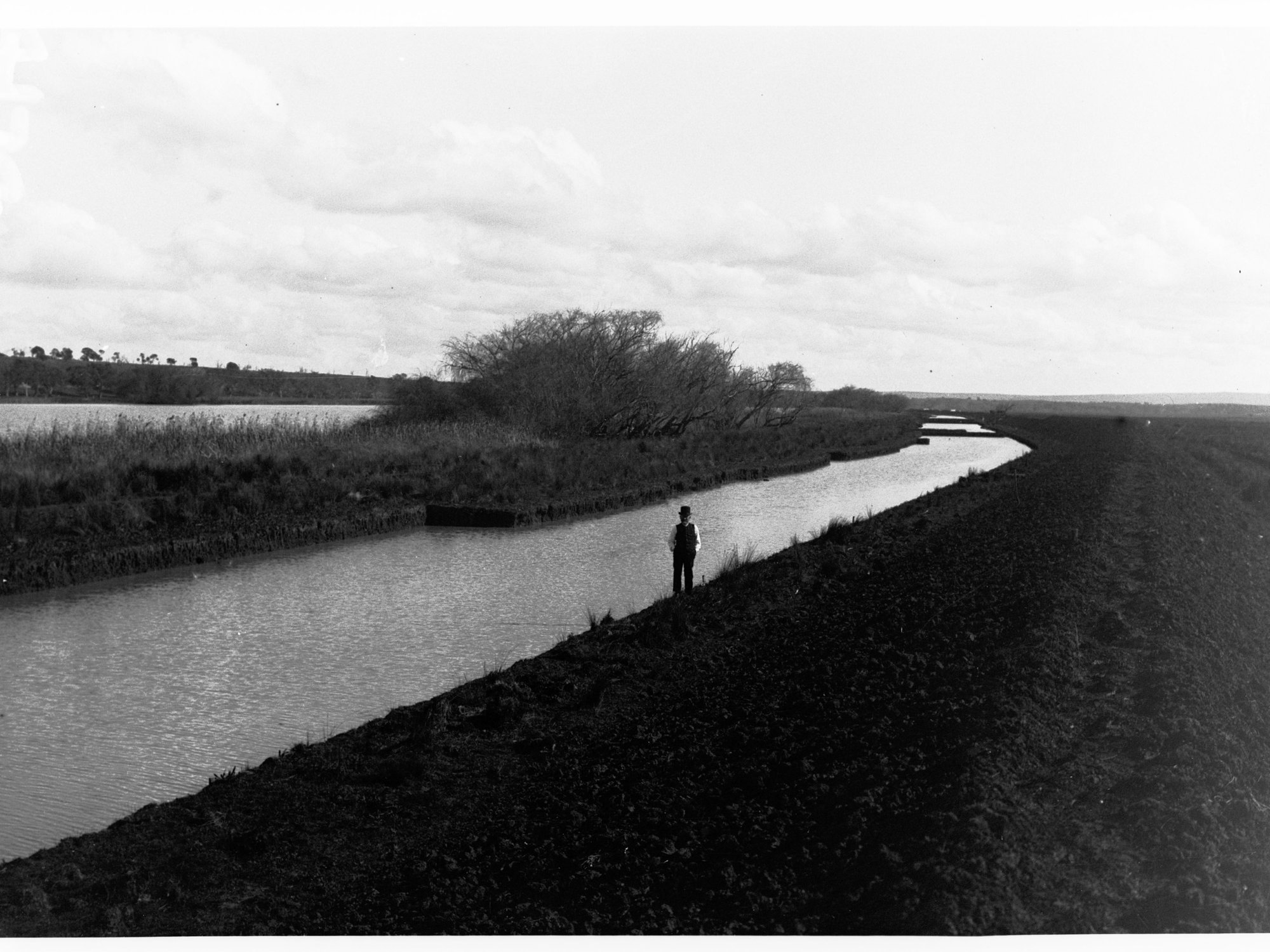 Man standing alongside South Eastern Drainage channels