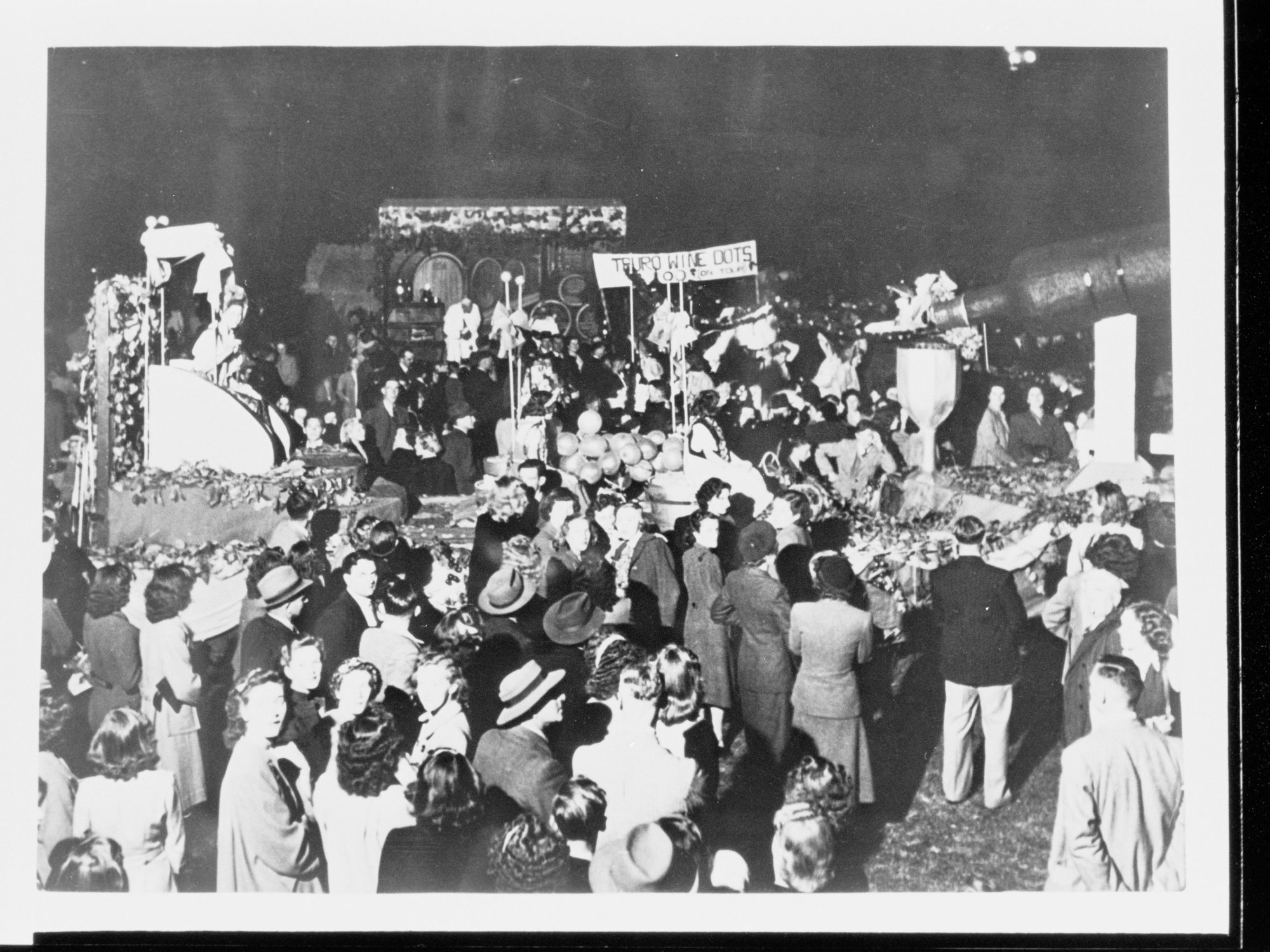 People at festival (banner reads Truro Wine Dots)
