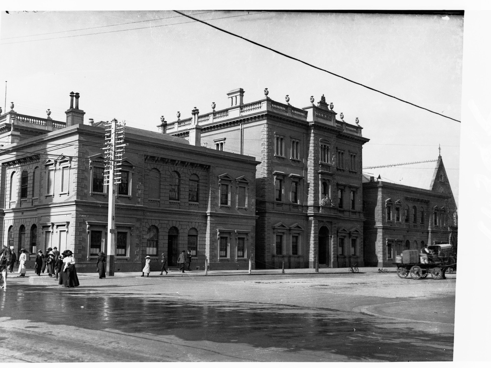 Government offices showing chief secretary and treasury offices on Flinders Street (taken from Victorica Square also showing church in background)