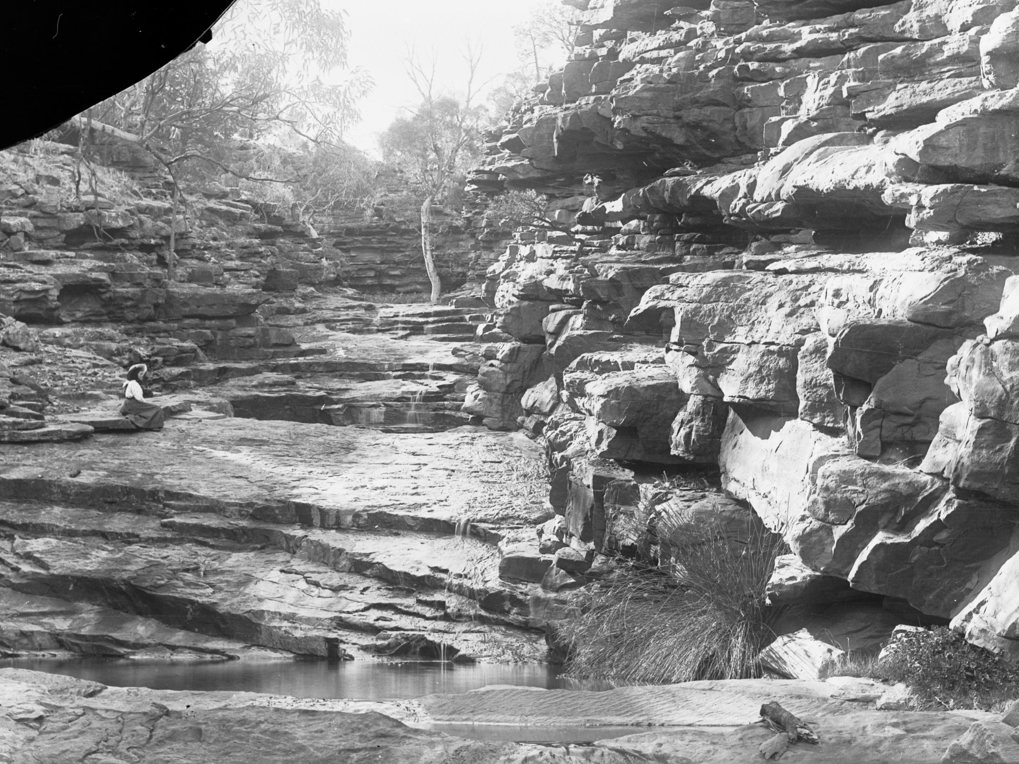 Rocky cliffs showing small stream