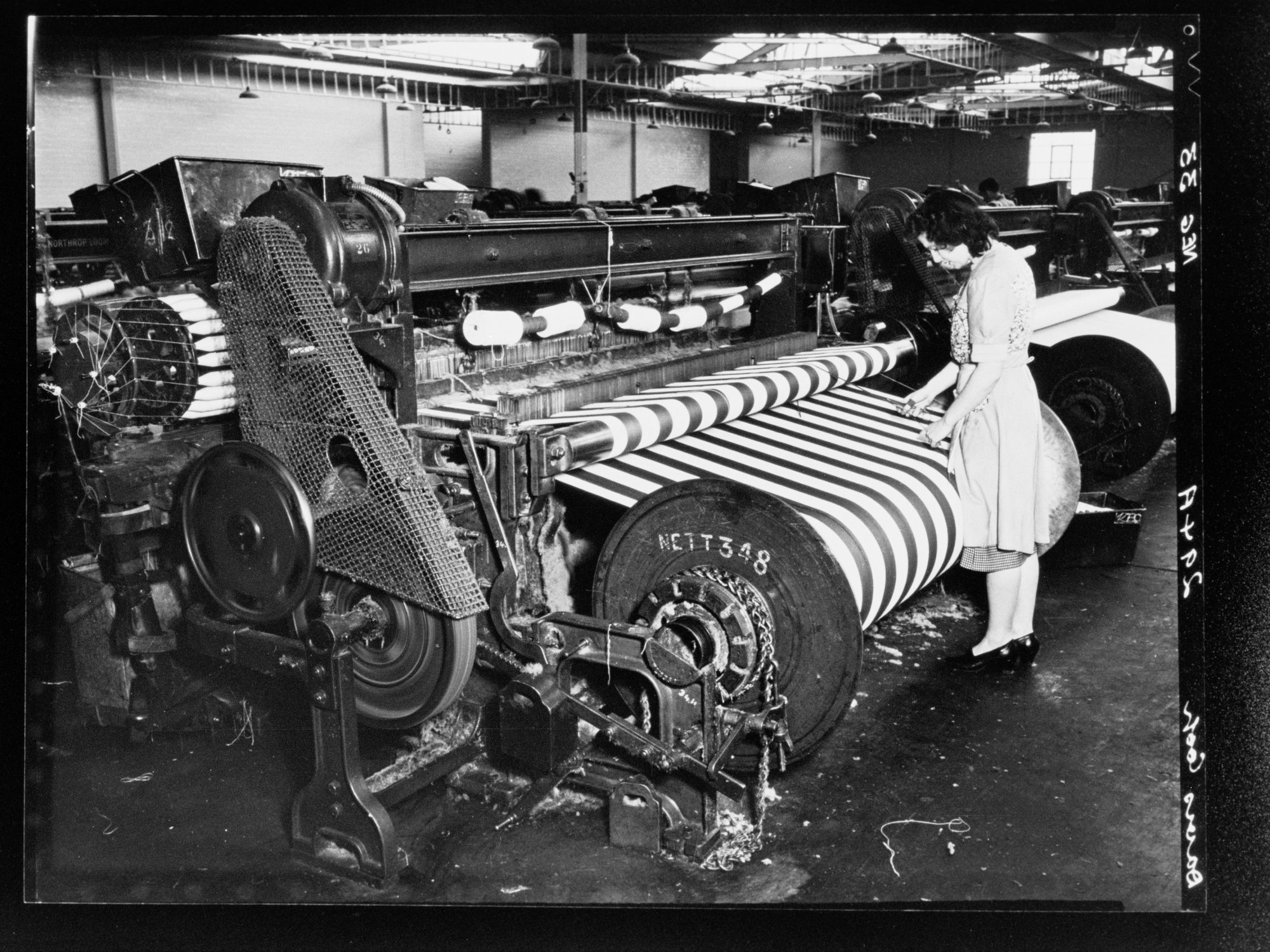 Davies Coop - factory worker using equipment