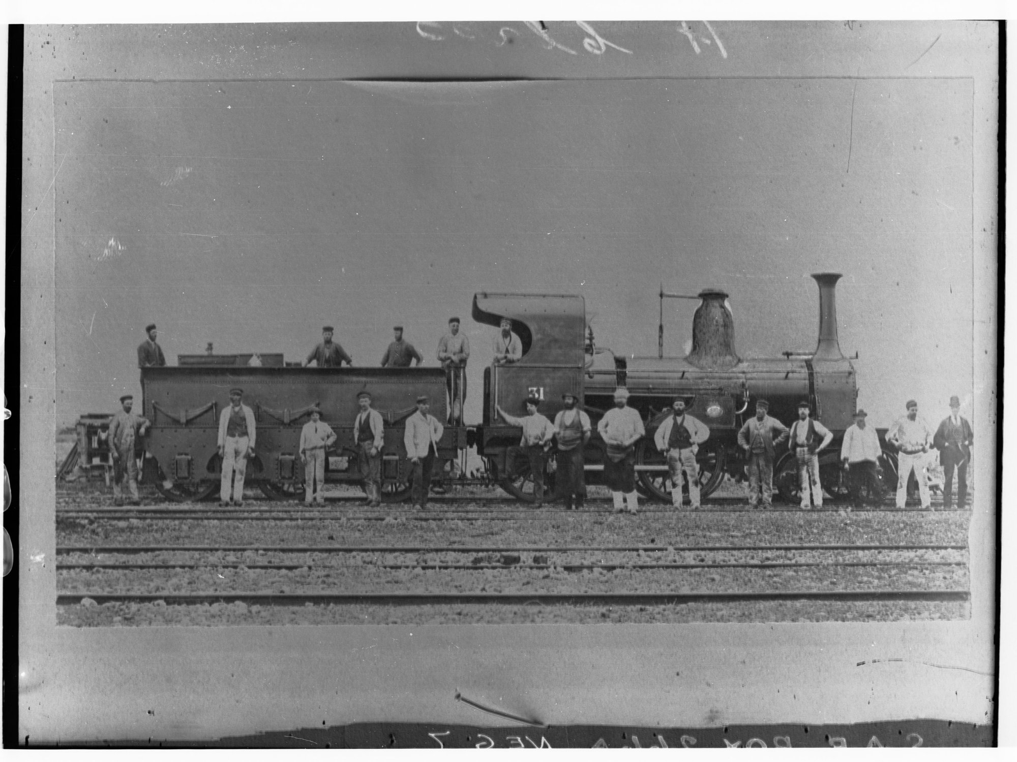 Steam locomotive showing employees