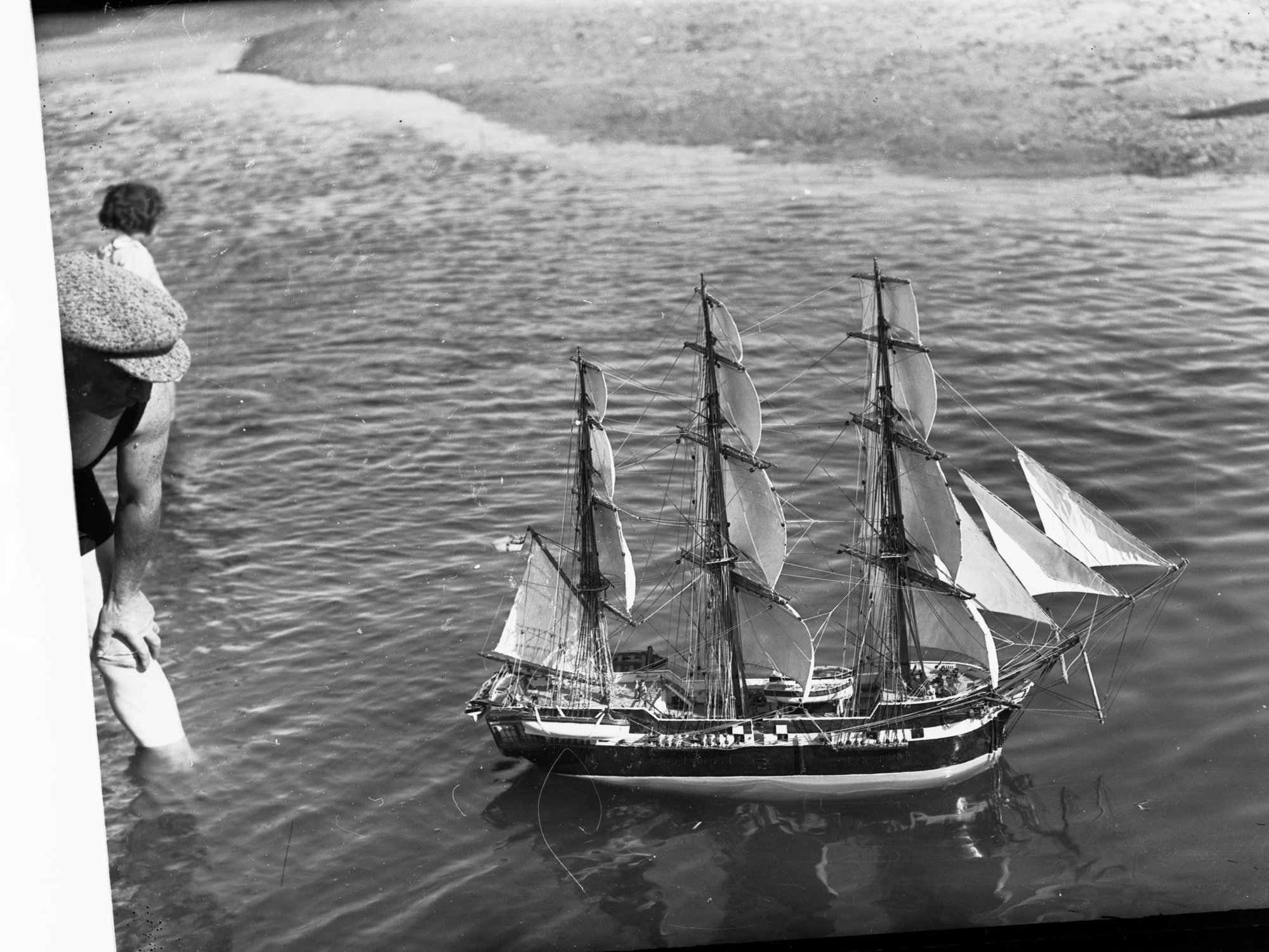 Model of HMS Buffalo at Glenelg, man at side watching