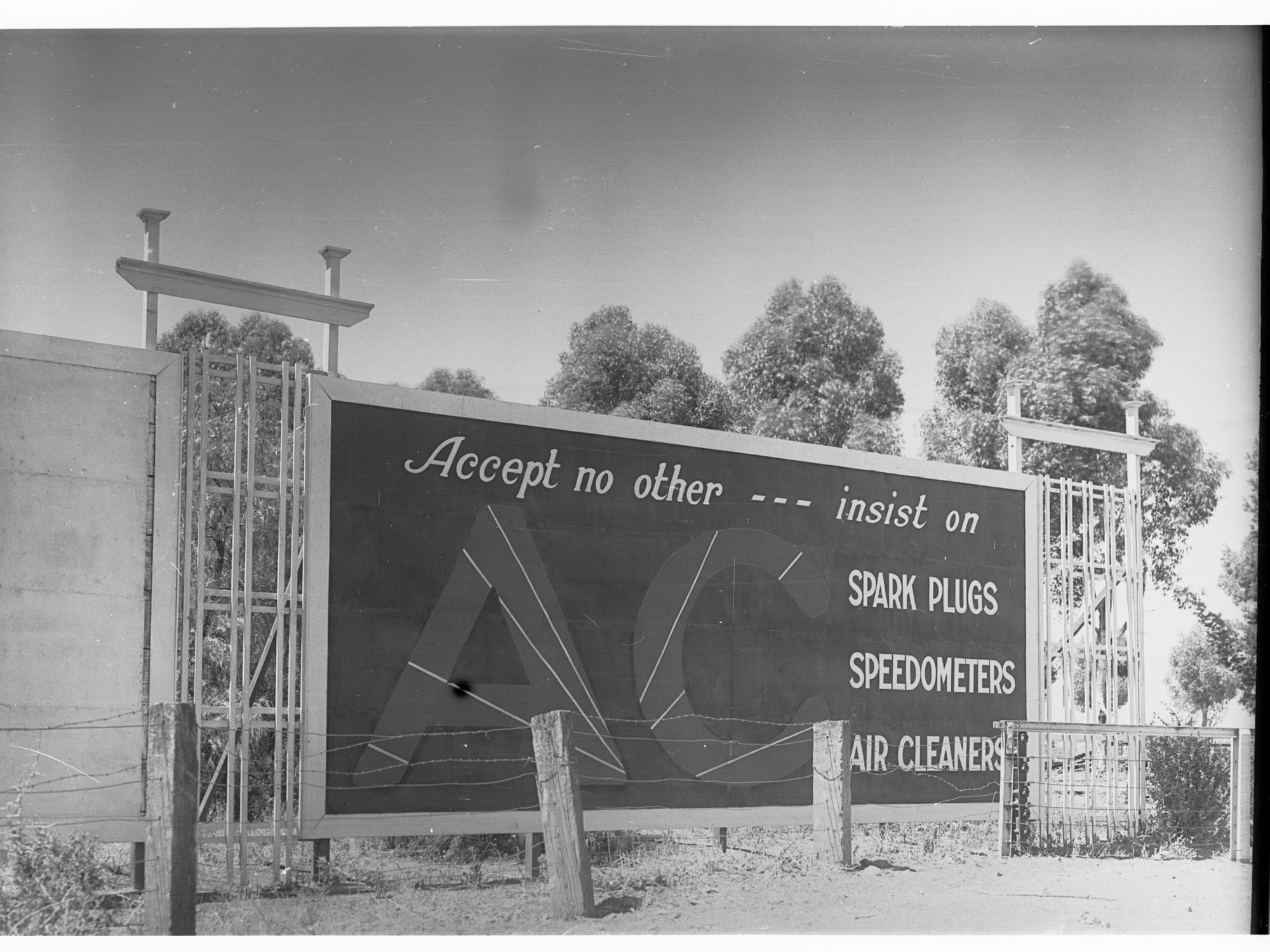 Billboard advertising AC sparkplugs - speedometers and air cleaners