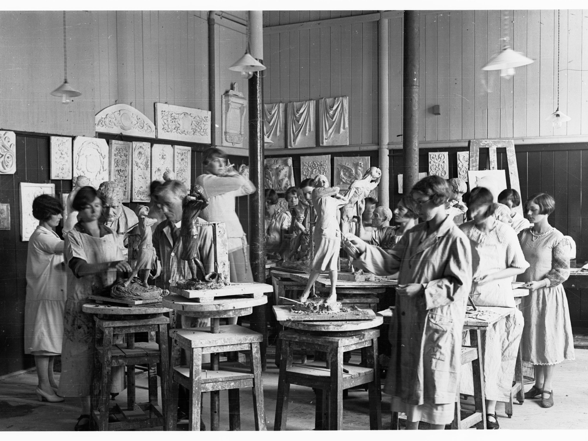 Students at art school doing sculpture