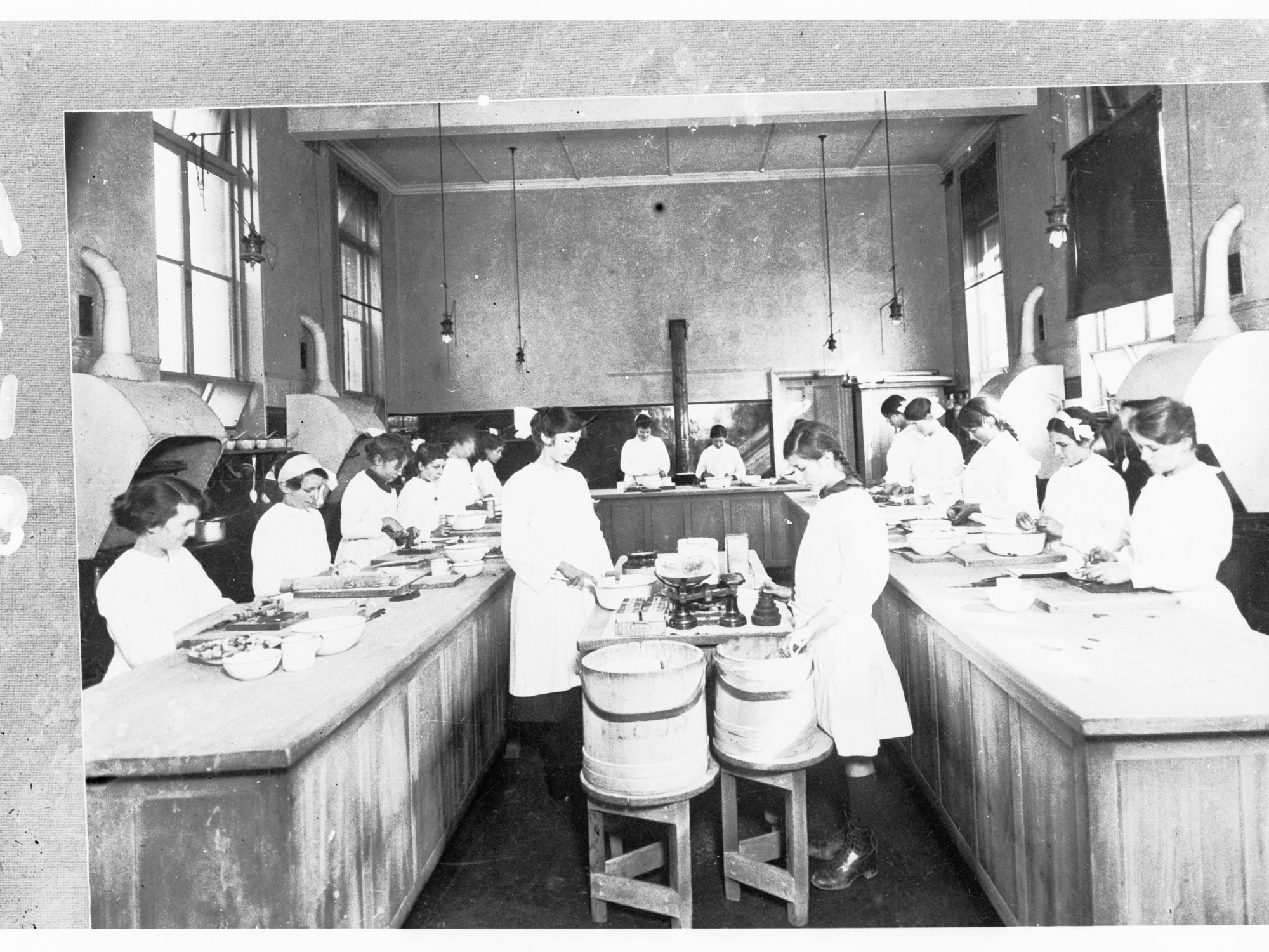 Girls in a class learning cooking skills