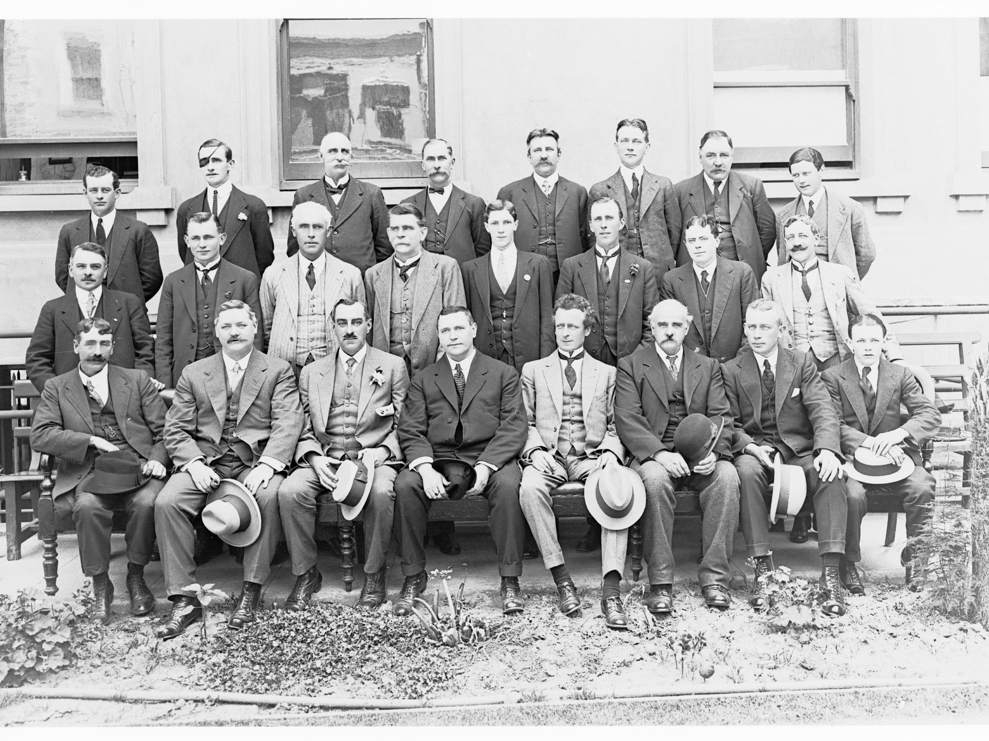Repatriation Group - group of men outside building