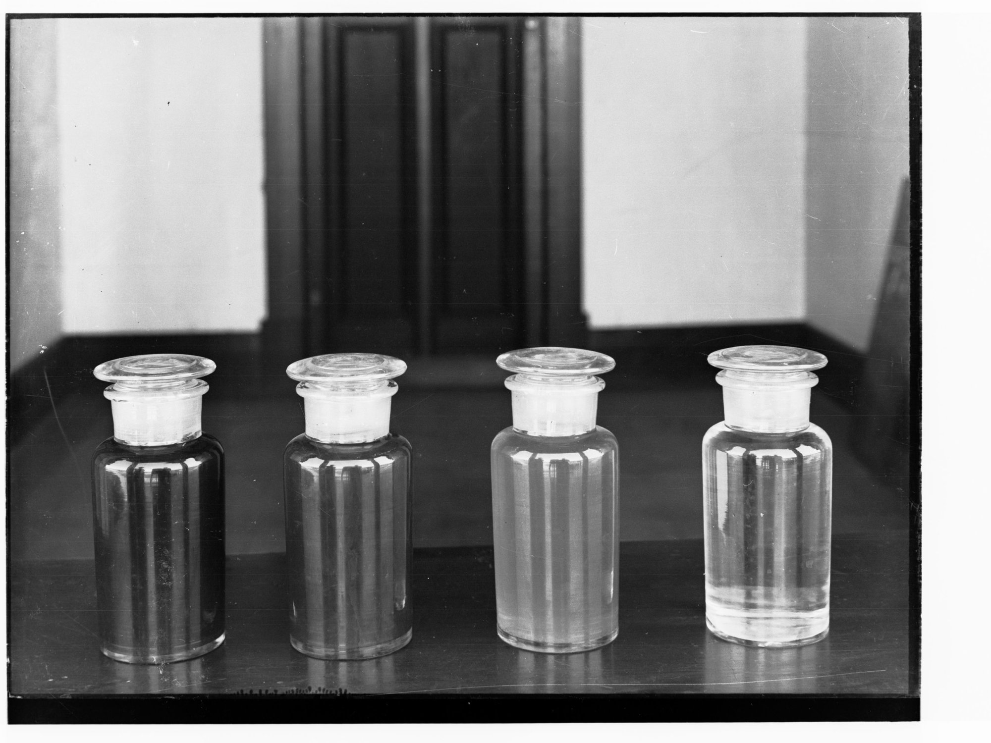 Four glass jars on a ledge