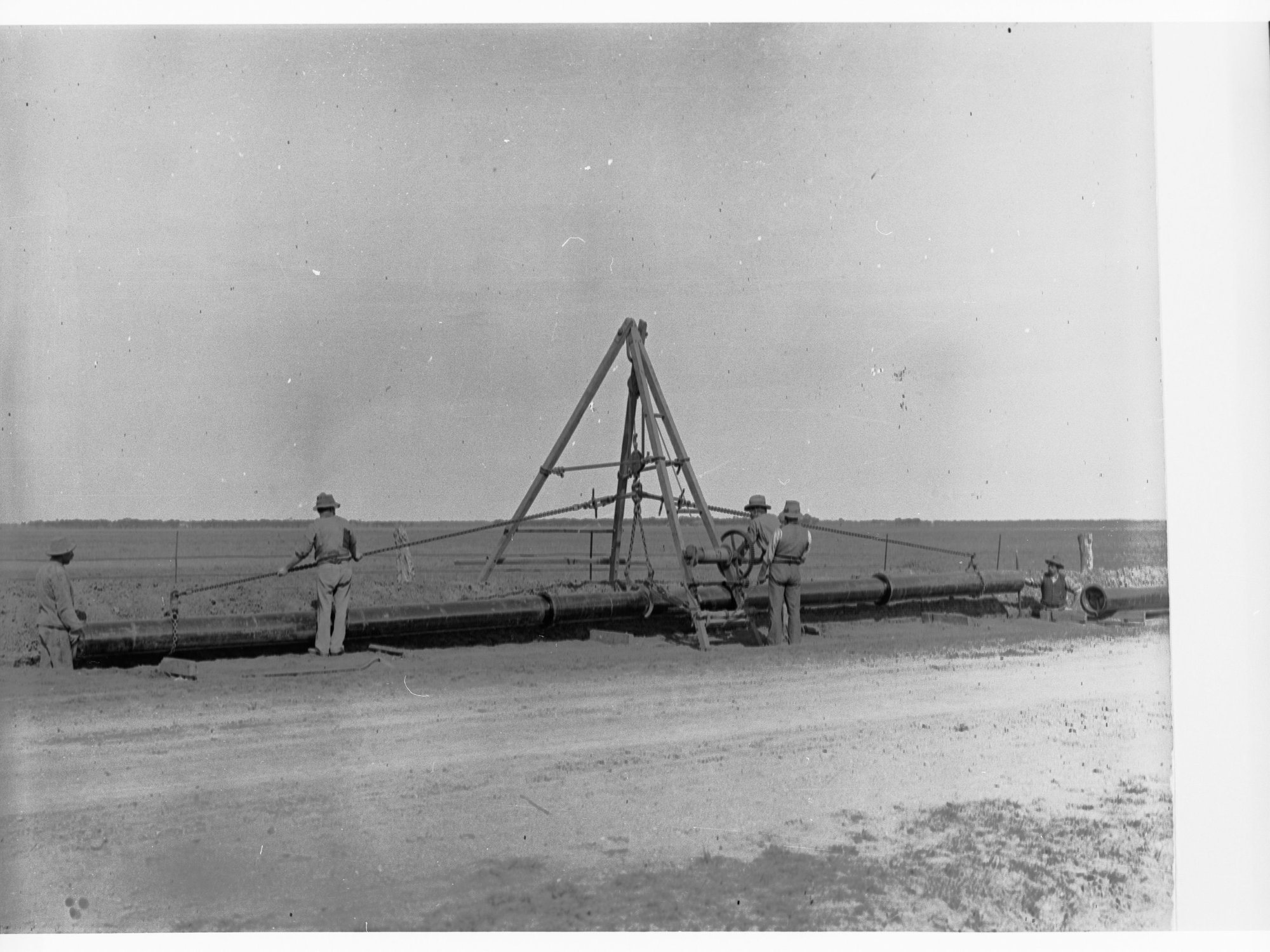 Men laying water pipes - location unknown, possibly Bundaleer