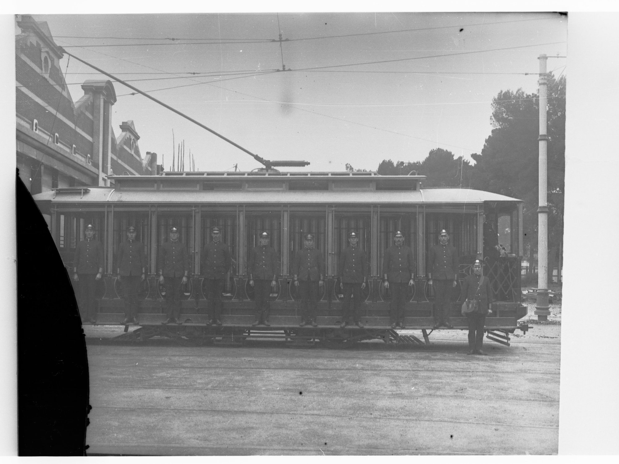 Tram showing conductors lined up along the side