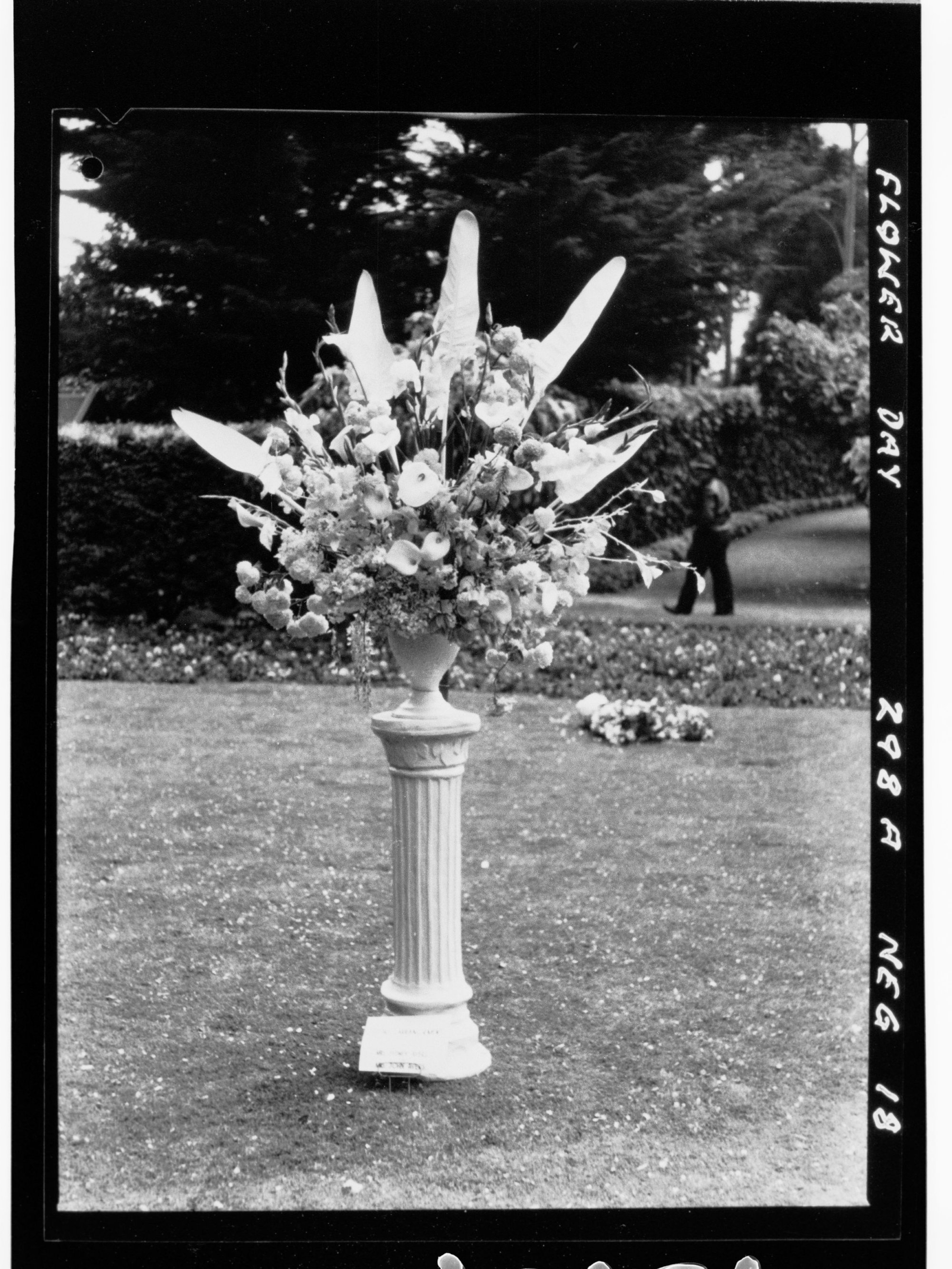 Flower Day - exhibit, pedestal with large vase of flowers