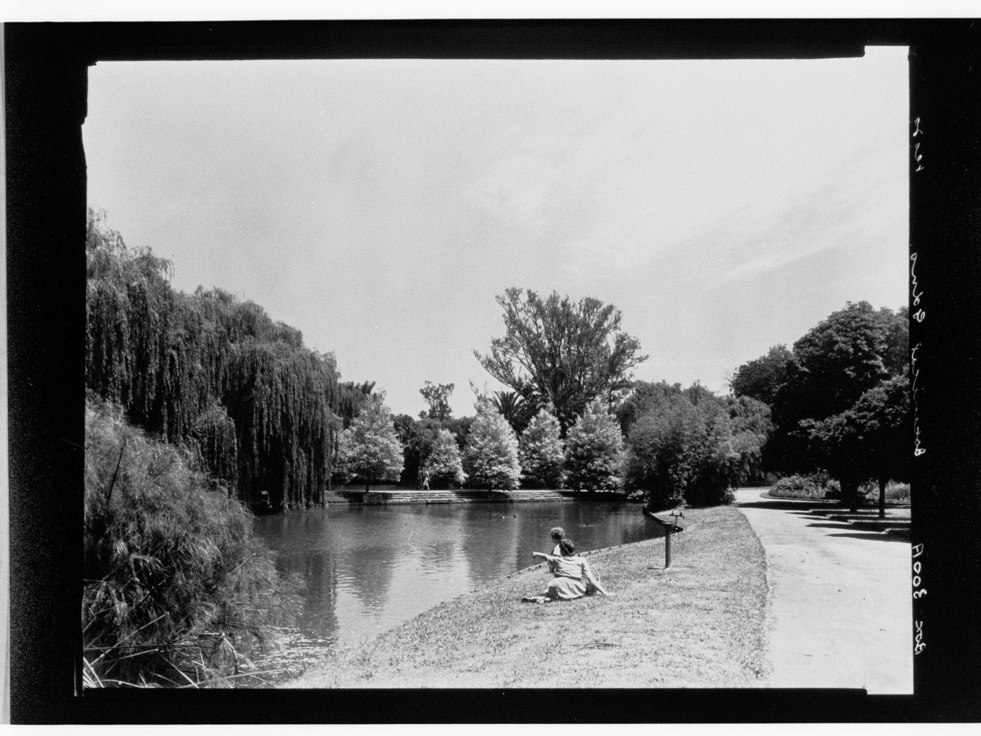 Botanncal Gardens - woman and child sitting next to water