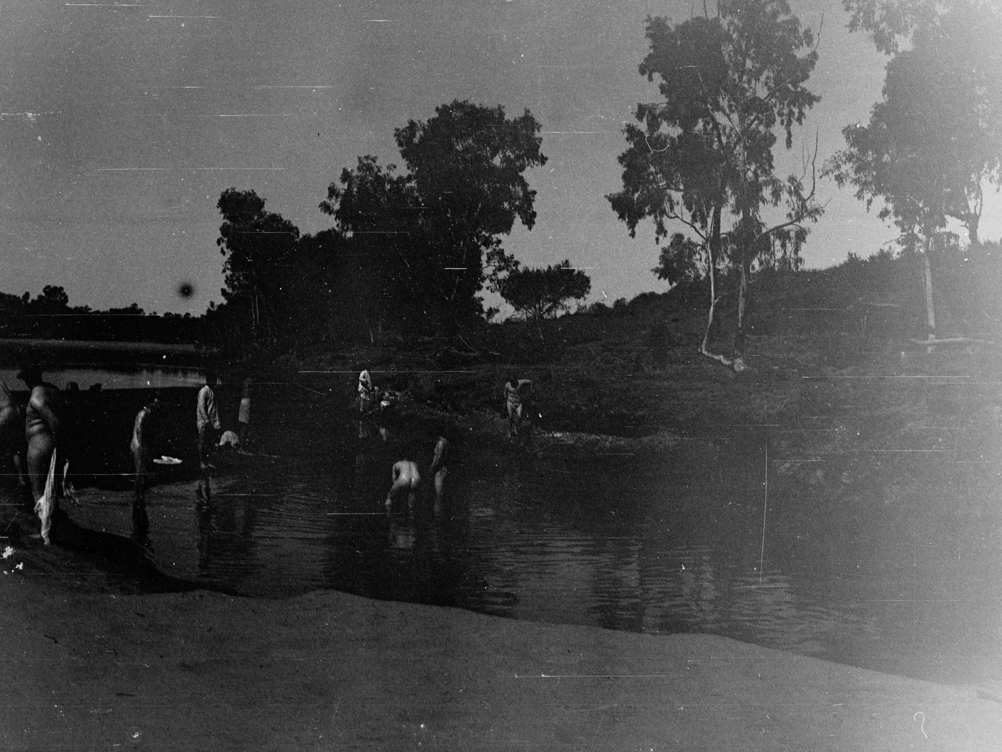 Parliamentary party on tour of Far North in Austin cars (government cars) - shows men bathing in river
