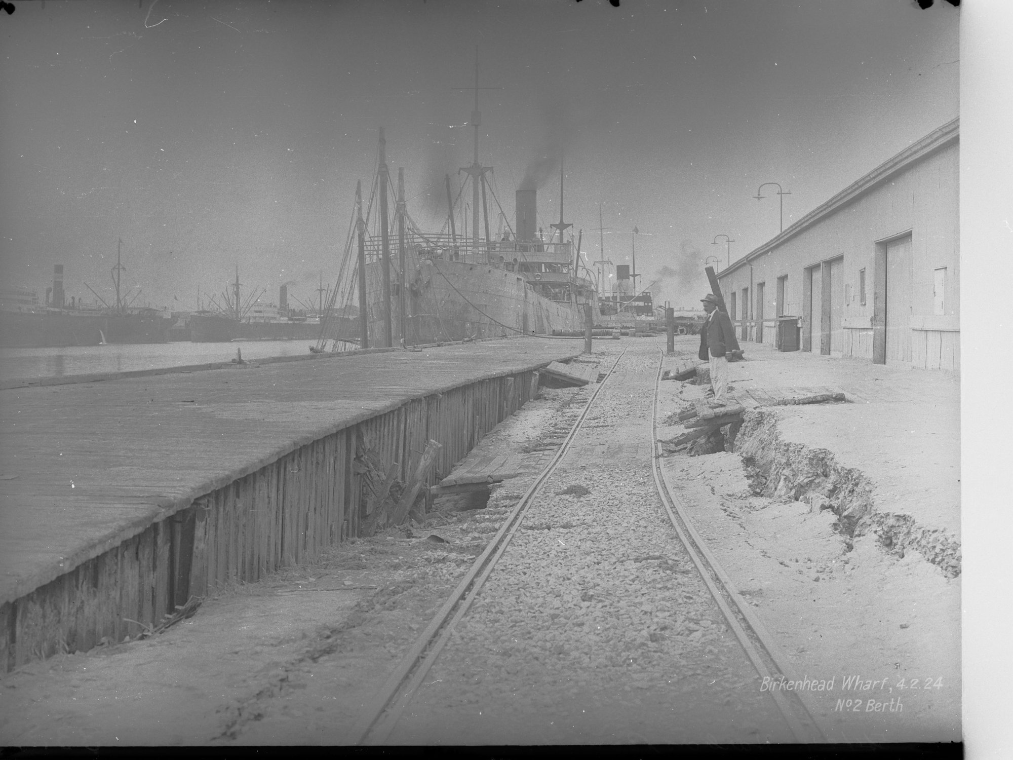 Birkenhead Wharf No. 2 Berth - shows steamship Australpool berthed at wharf and also shows subsidence in roadway