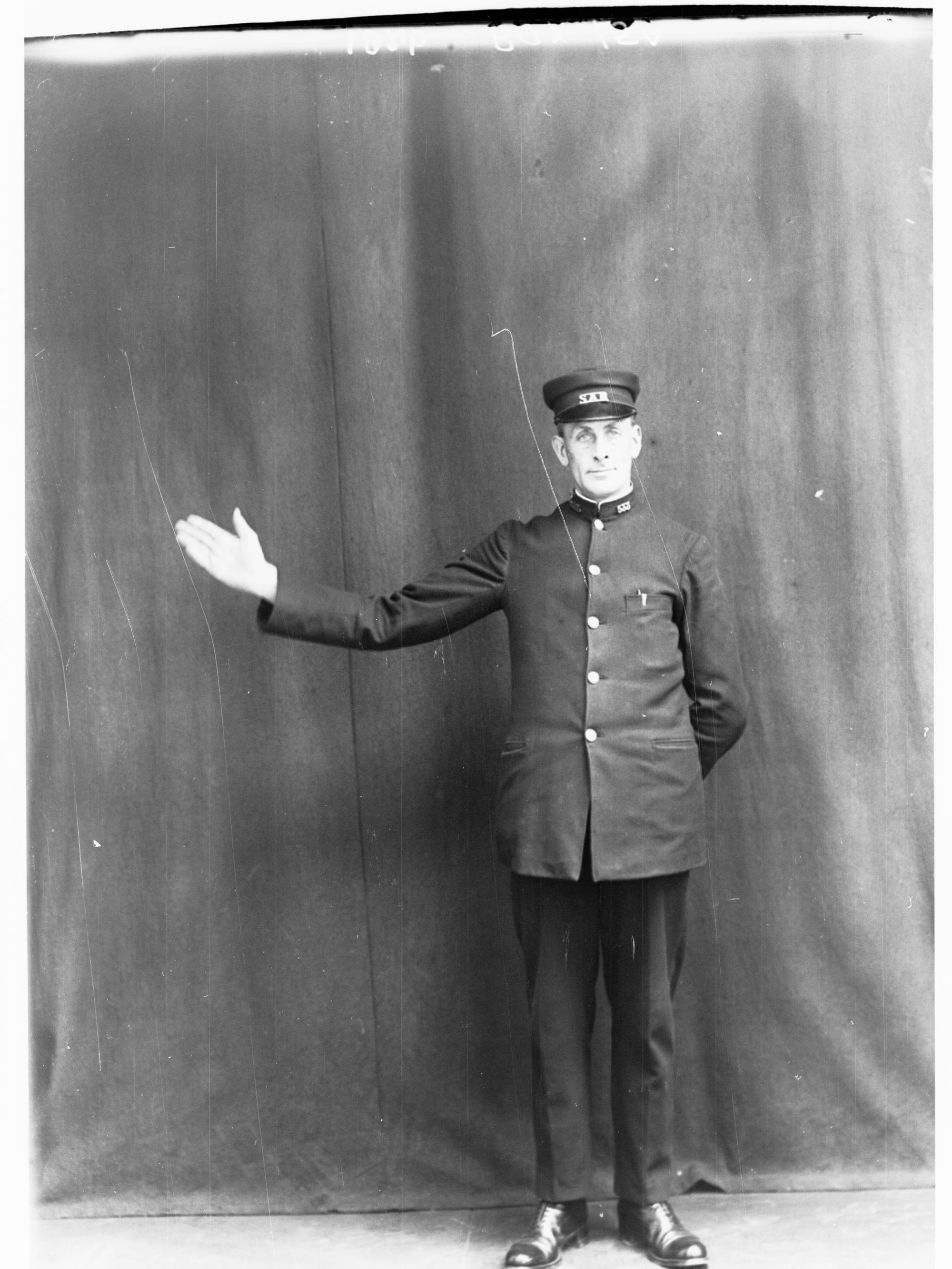 Porter demonstrating railway hand signals