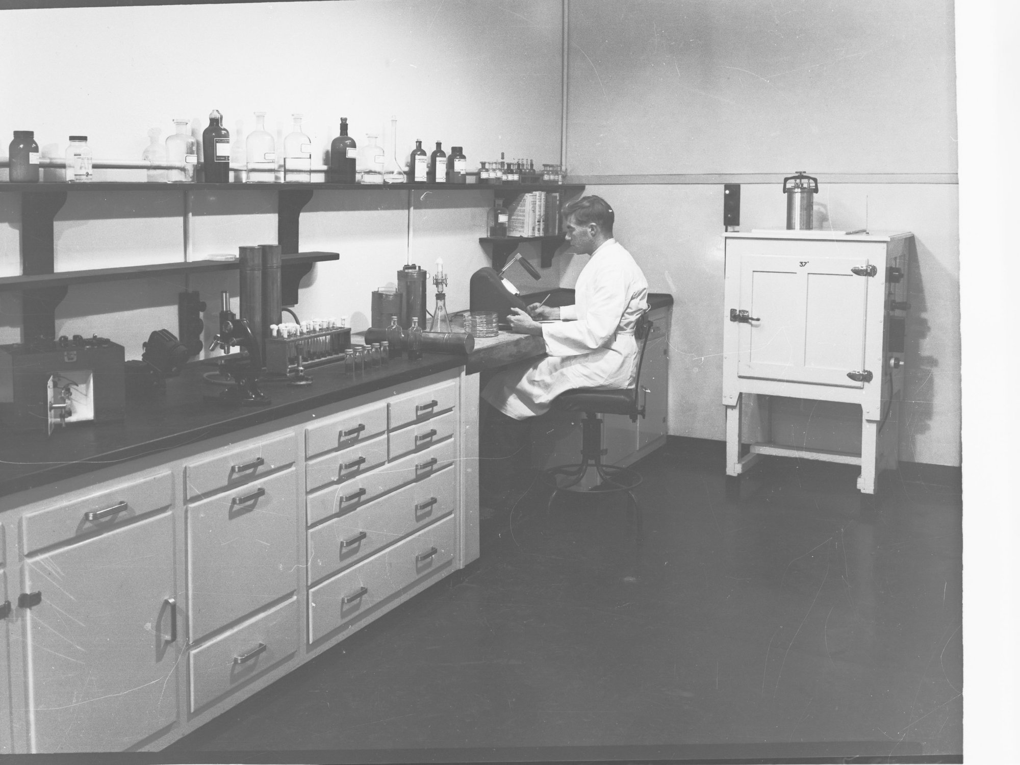 Engineering and water supply, showing man working in laboratory - Glenelg Sewerage Treatment Works