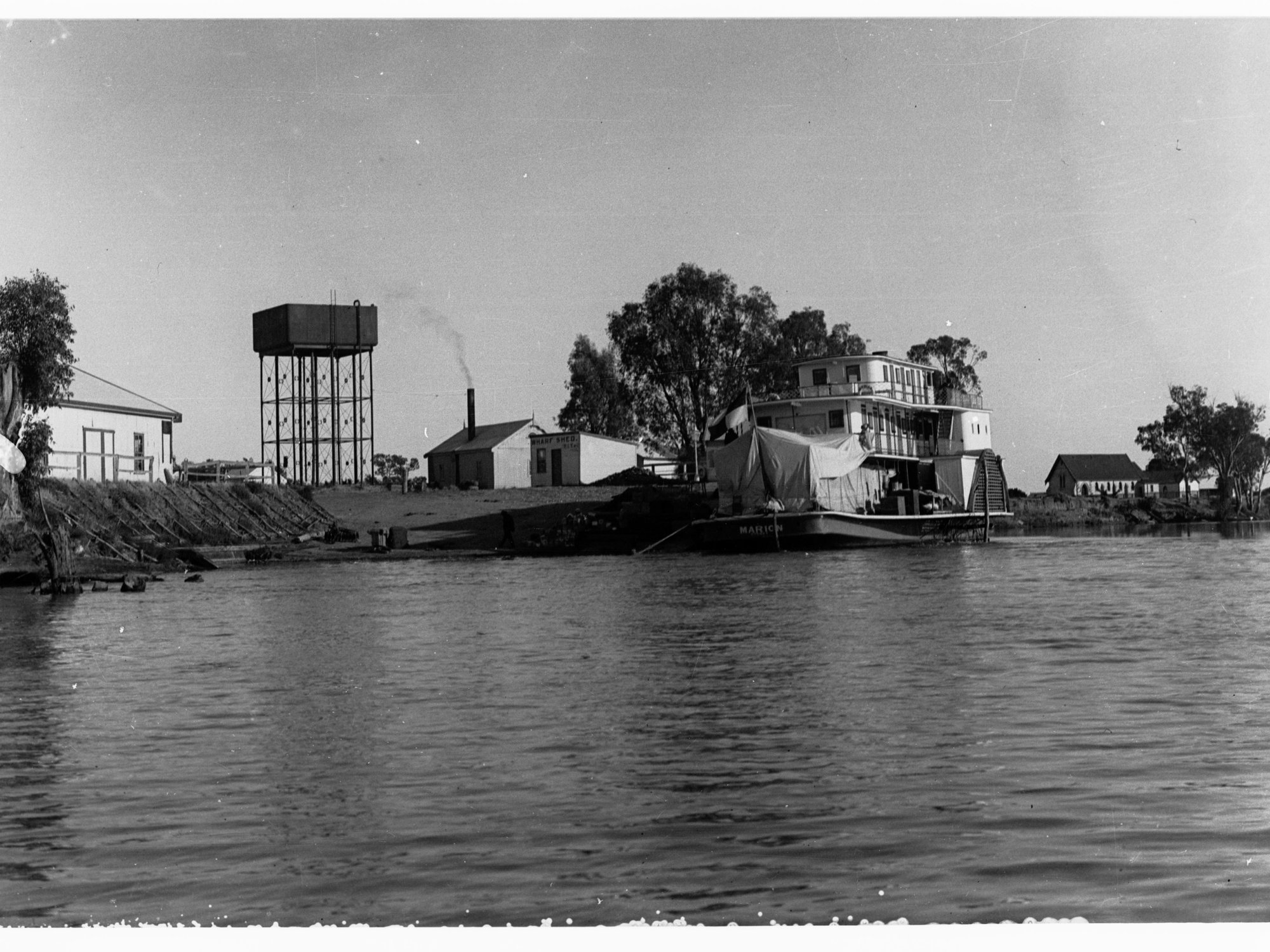Renmark landing showing River Murray and paddlesteamer with sheds nearby