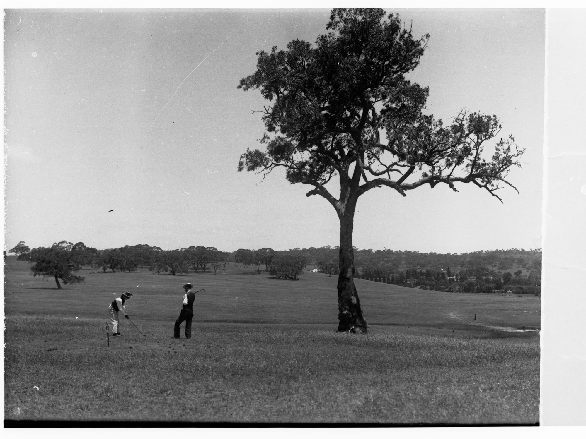 Men on golf links at Clare