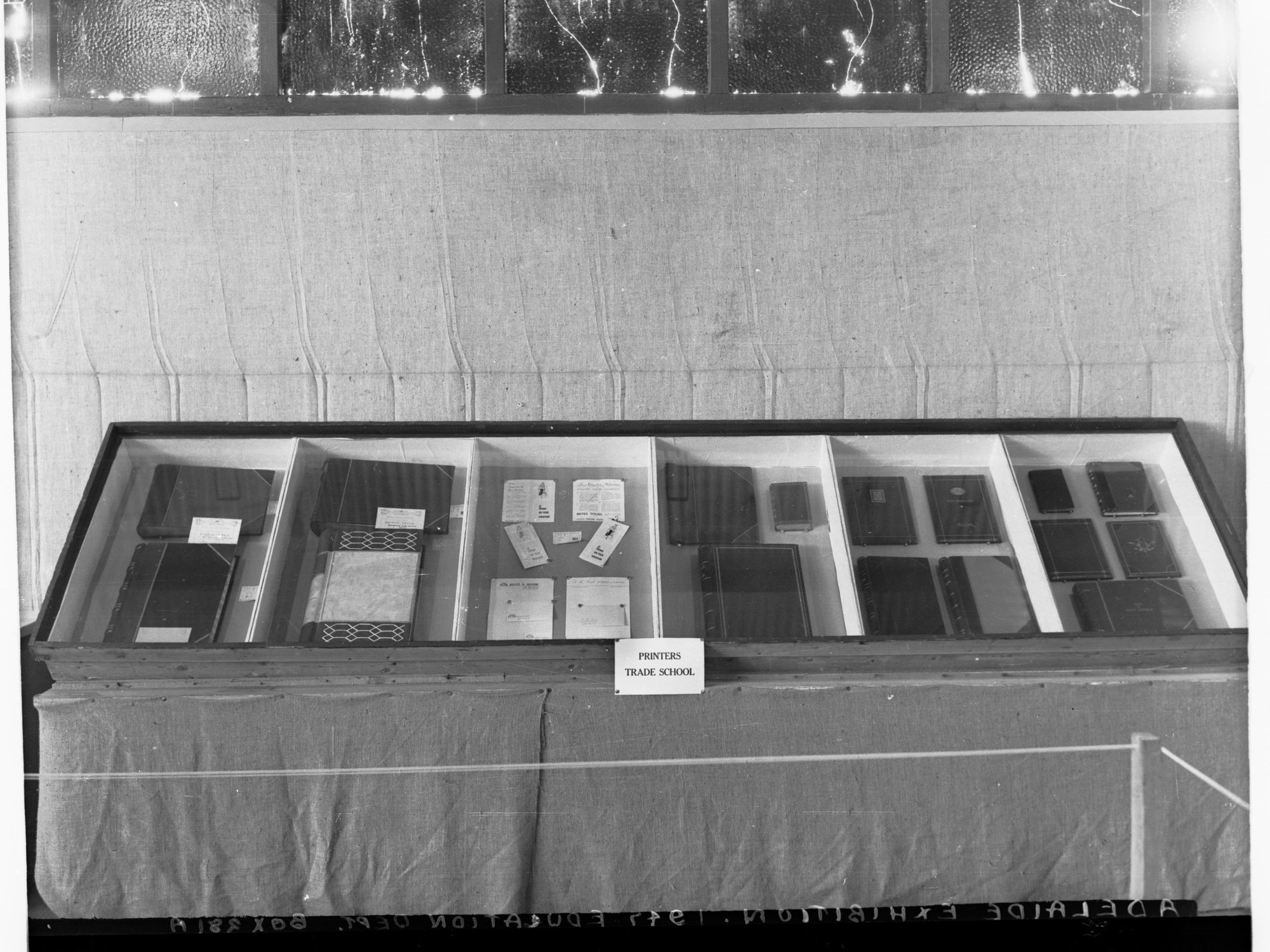 Printers Trade School Exhibition showing books in glass cabinet