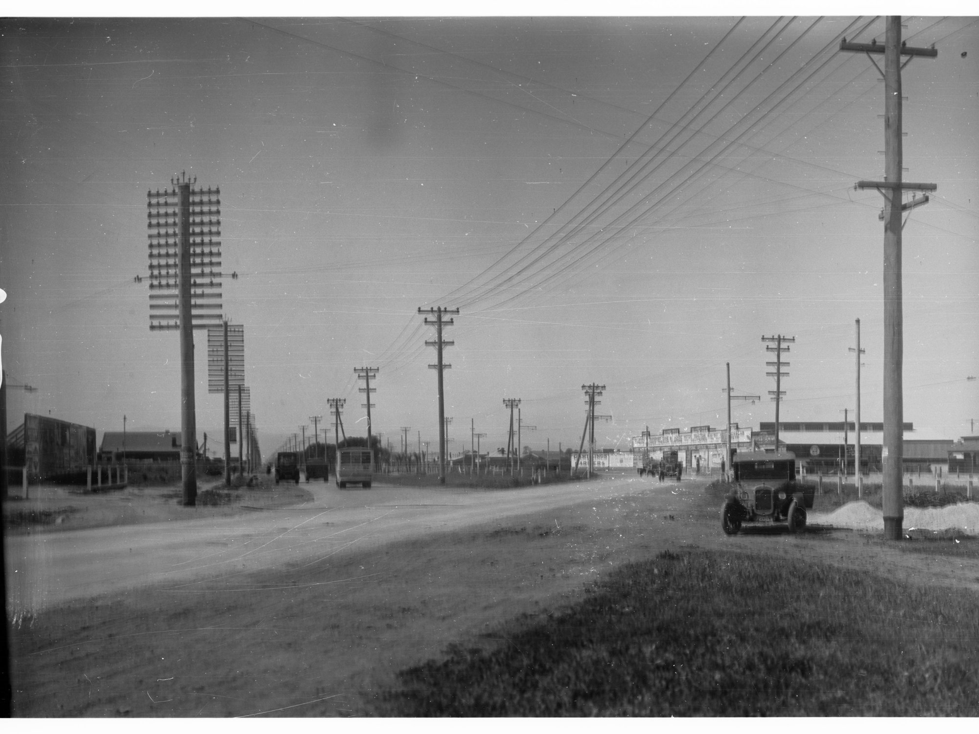 Port Road at Albert Park Showing Automobile and a Bus