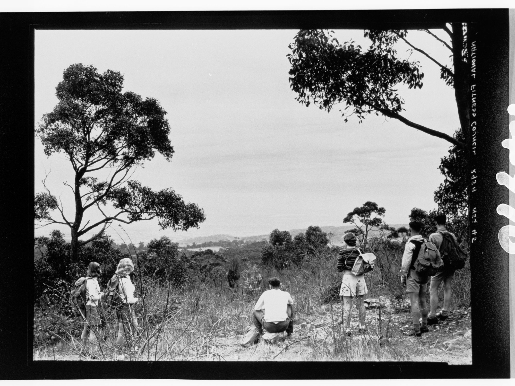 National Fitness Council - people with backpacks standing on hill