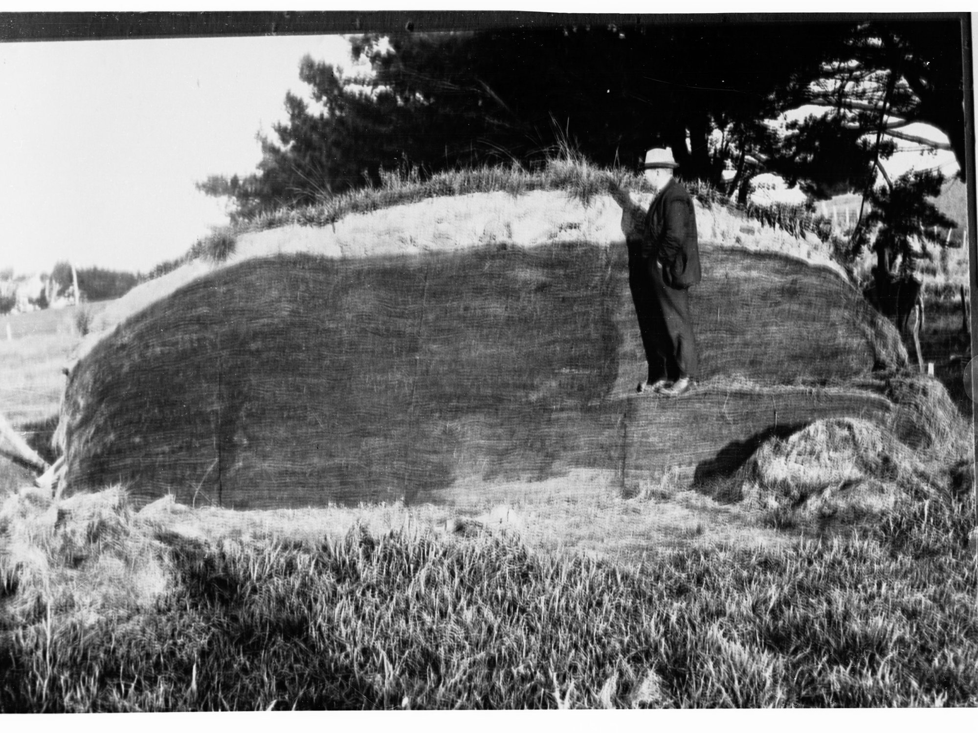 Men Standing by Haystack