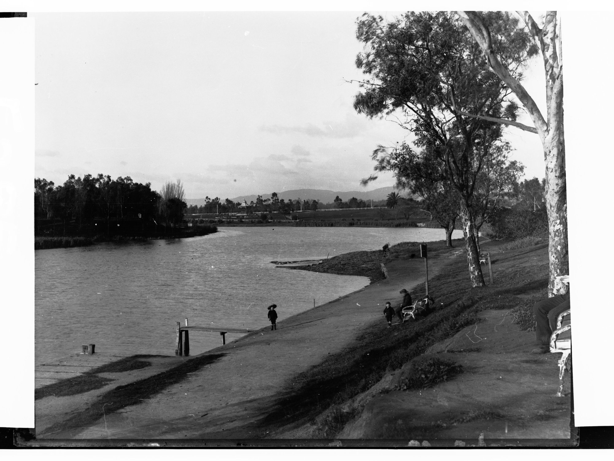 Torrens River Showing Man and Children Sitting on Park Bench
