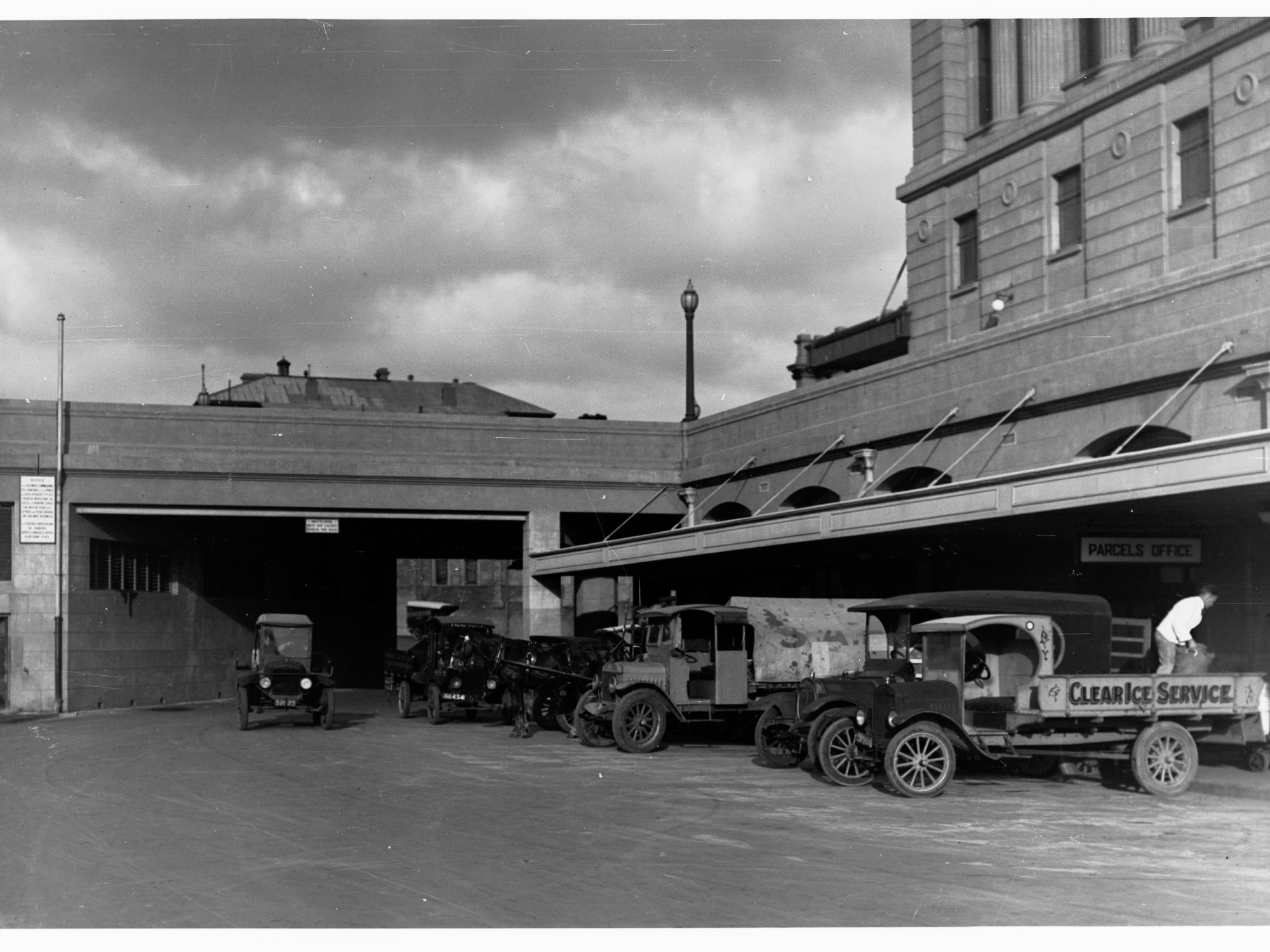 Adelaide Railway Station parcels office showing truck and automobiles