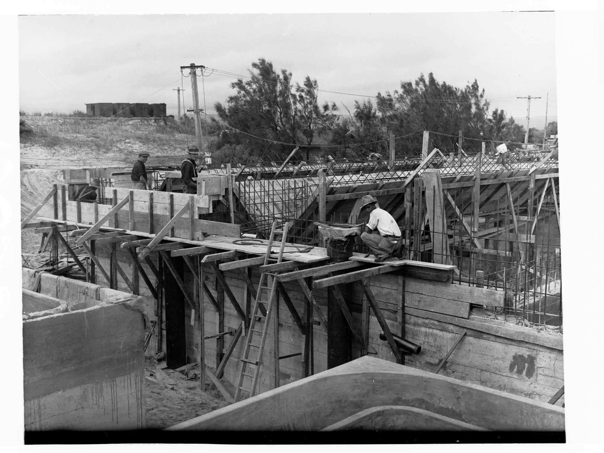 Glenelg Sewerage showing three men working
