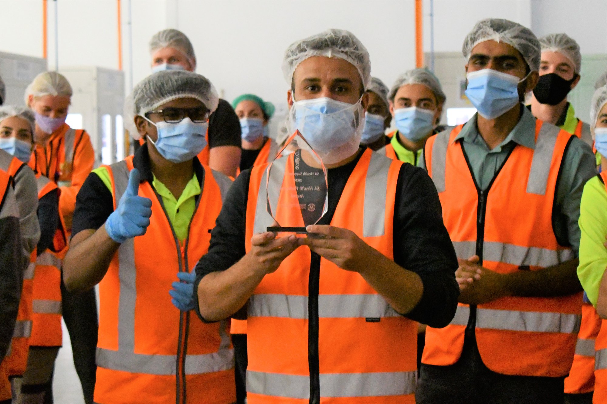 Detmold Medical workers holding SA Health Partnership Award for 2020.