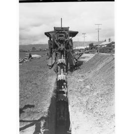 Glenelg Sewers showing machine digging a ditch