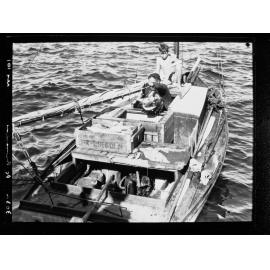 Man and boy in fishing boat, Port Lincoln