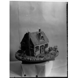 Model of cottage made from cake for Education Department