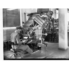 Student Working Type-Setting Machine at Printers Trade School