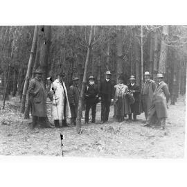Men gathered in forest