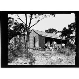 National Fitness Council - people outside a stone cottage