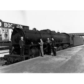 Mr A N Day Standing on the Front of a Locomotive Engine
