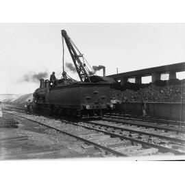 Loading coal onto a locomotive tender at Mile End - Railway Commissioner's Report