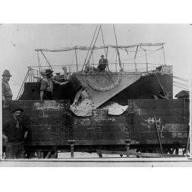 Men working on a wharf - Harbours Board Report