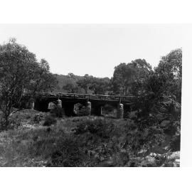 Rural Scene with Bridge and Sheep in Background