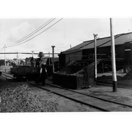 Wallaroo Mines, unloading rough ore into acid burners, showing men working